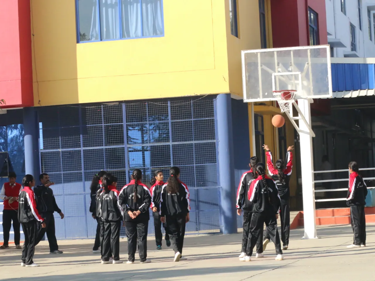 Students Playing on the Basketball Court